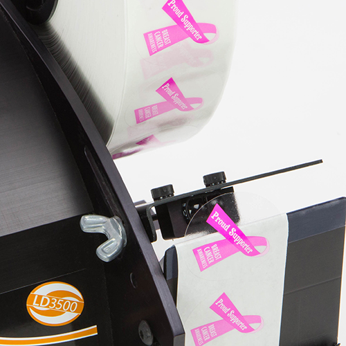 Distributeur automatique de pièce découpées adhésives et étiquettes transparentes Adezif DAA50 Labelmoto LD3500